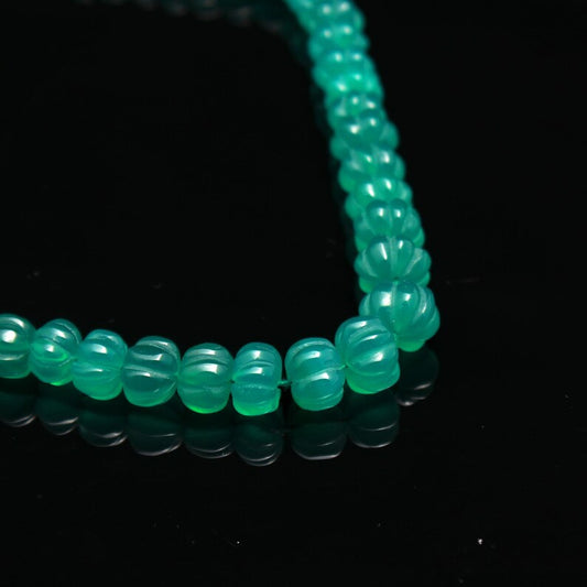 A stunning 18-inch strand of natural Green Onyx melon curved beads, ideal for designing unique and elegant jewelry pieces.
#GreenOnyx #MelonBeads #GemstoneJewelry #JewelryMaking #NaturalGemstones #BeadedJewelry #CustomJewelry #LuxuryJewelry #UniqueDesigns #ElegantJewelry