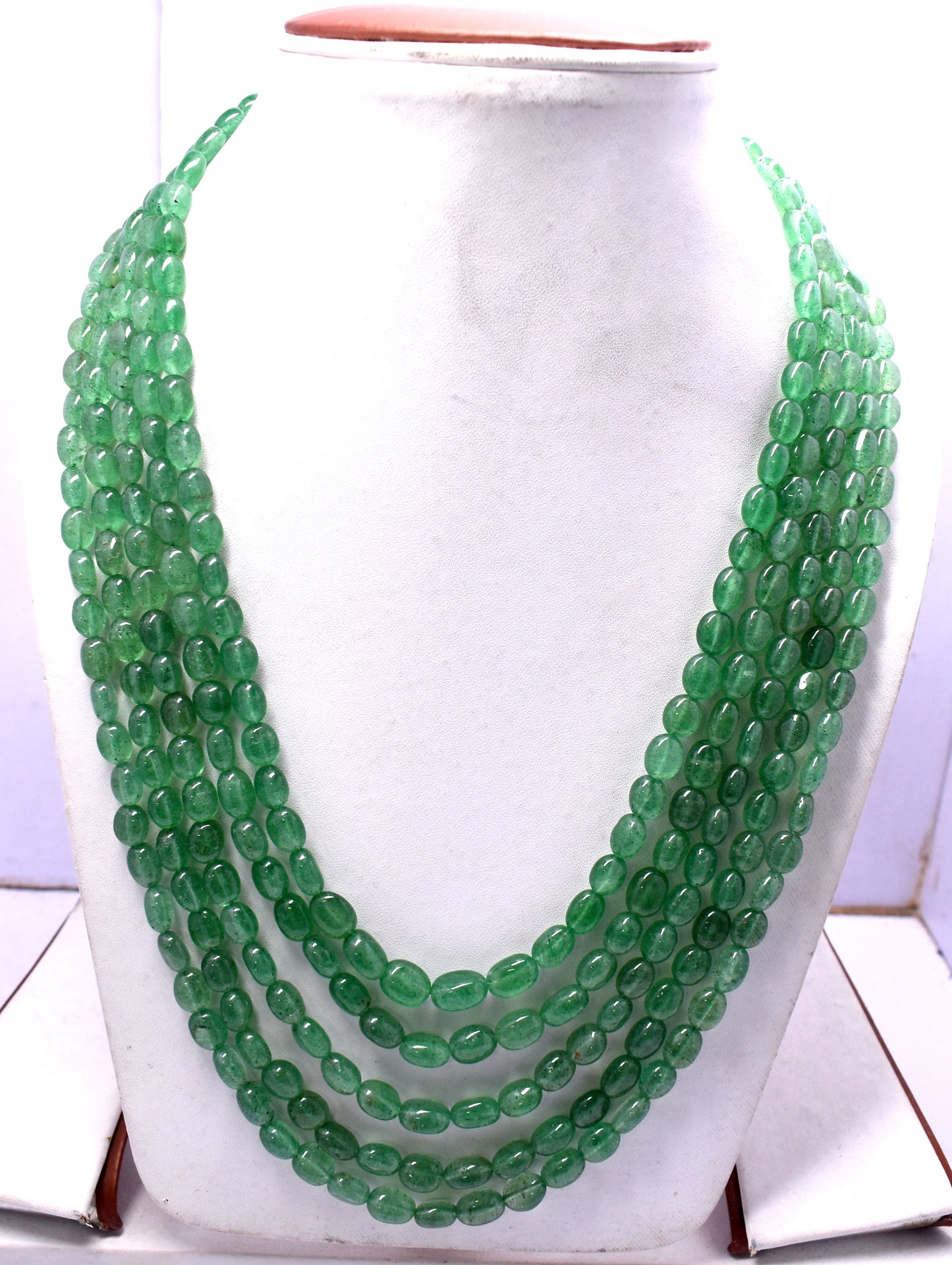 A vibrant 5-line bunch necklace featuring Green Aventurine mani beads, weighing 715 carats.
#GreenAventurine #ManiBeads #GemstoneJewelry #LuxuryJewelry #StatementNecklace #NaturalGemstones #ChicJewelry #ElegantStyle #BeadedNecklace
