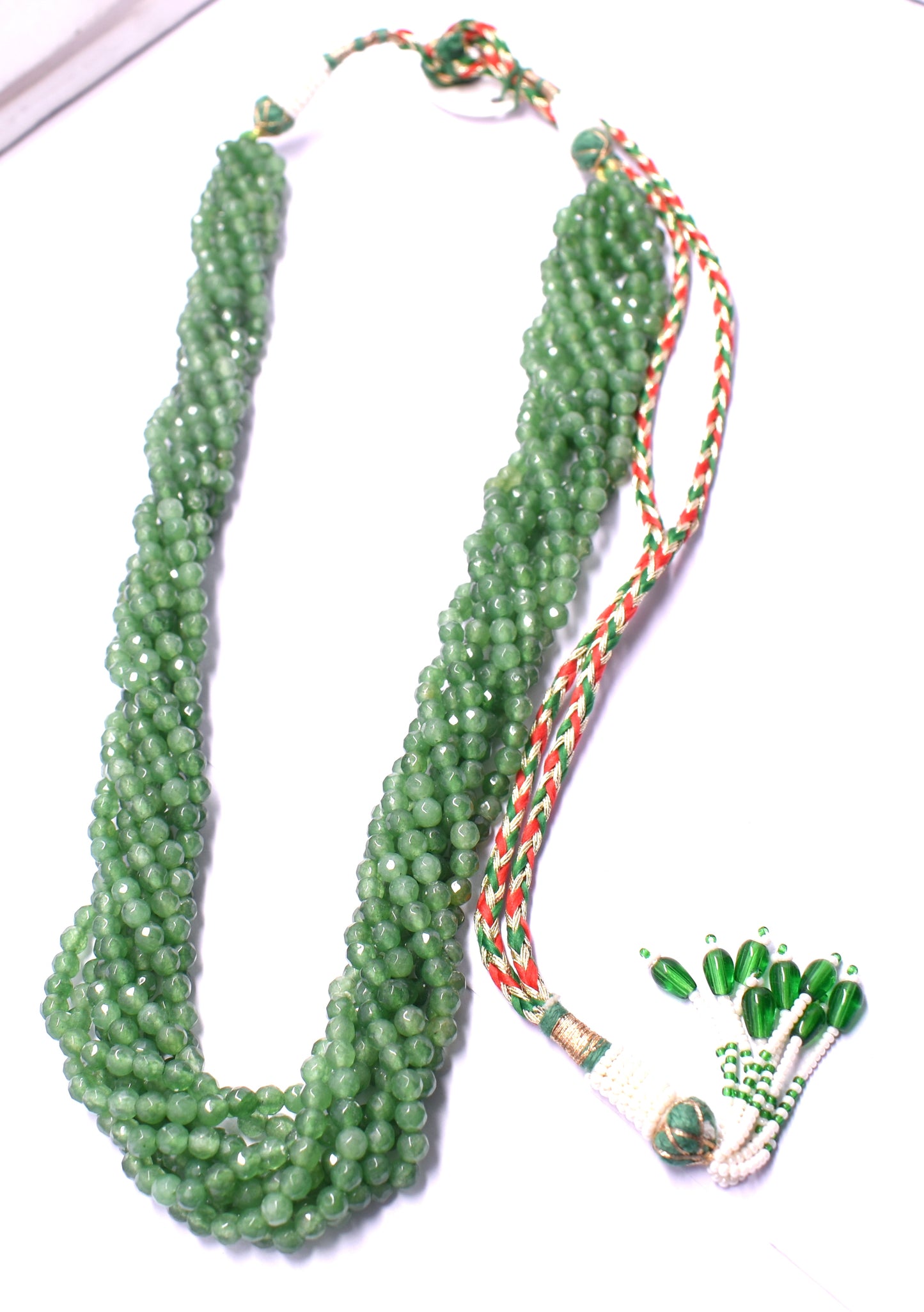 An elegant 12-line bunch necklace with faceted green jade beads, weighing 139 grams.
#GreenJade #JadeNecklace #FacetedBeads #GemstoneJewelry #ChicJewelry #LuxuryJewelry #StatementNecklace #BeadedNecklace #NaturalGemstones #ElegantStyle