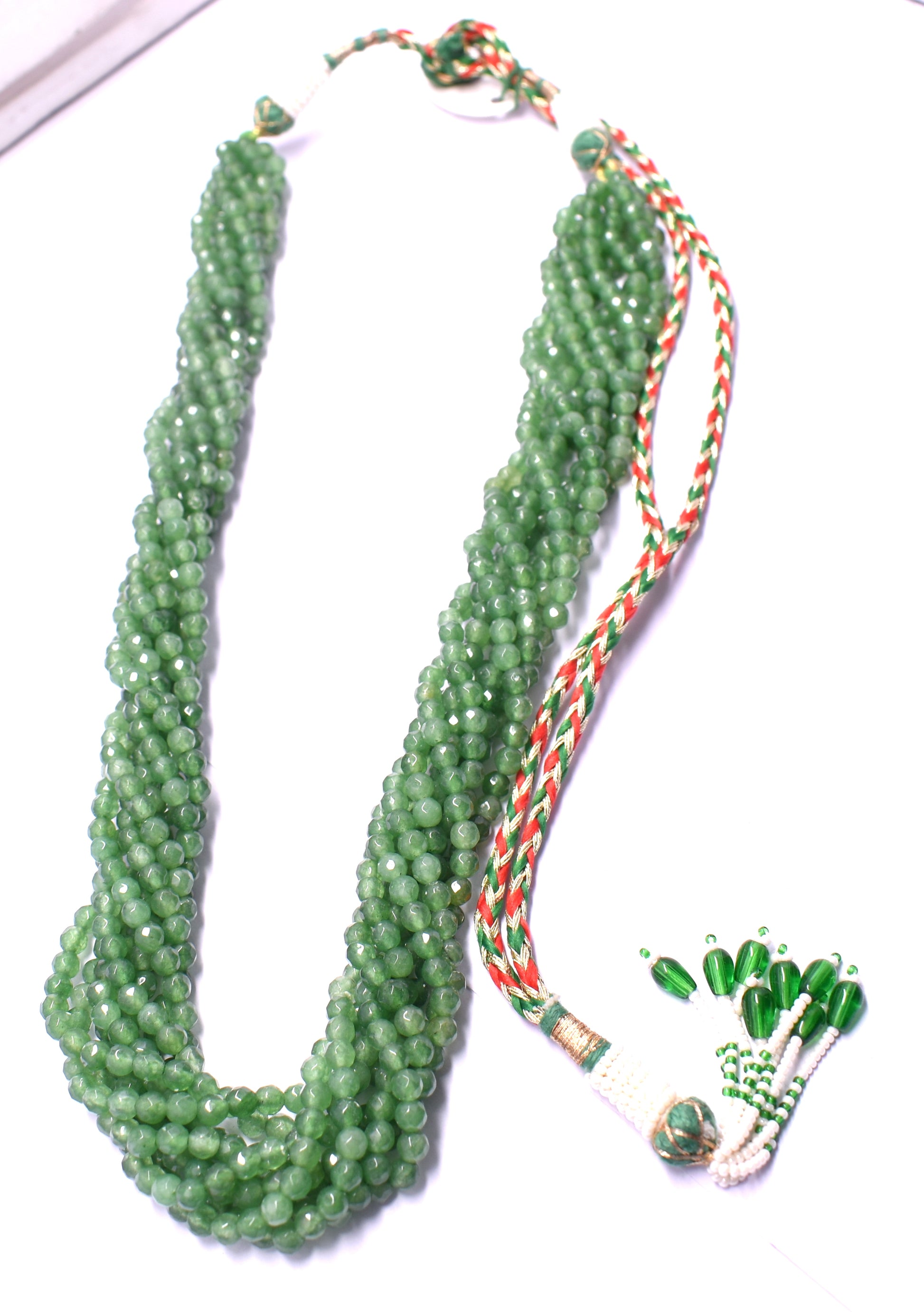 An elegant 12-line bunch necklace with faceted green jade beads, weighing 139 grams.
#GreenJade #JadeNecklace #FacetedBeads #GemstoneJewelry #ChicJewelry #LuxuryJewelry #StatementNecklace #BeadedNecklace #NaturalGemstones #ElegantStyle
