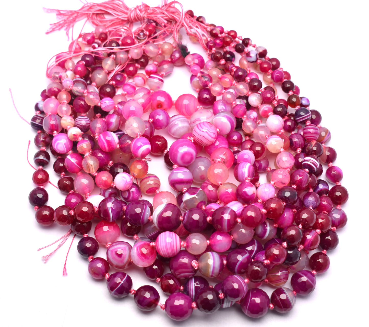This beautiful strand features knotted, round faceted pink banded agate beads (6mm to 16mm) for a unique and elegant look.
 #PinkBandedAgate #AgateBeads #GemstoneJewelry #FacetedBeads #HealingCrystals #CrystalJewelry #FashionJewelry