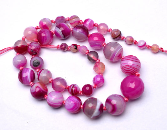 This beautiful strand features knotted, round faceted pink banded agate beads (6mm to 16mm) for a unique and elegant look.
 #PinkBandedAgate #AgateBeads #GemstoneJewelry #FacetedBeads #HealingCrystals #CrystalJewelry #FashionJewelry