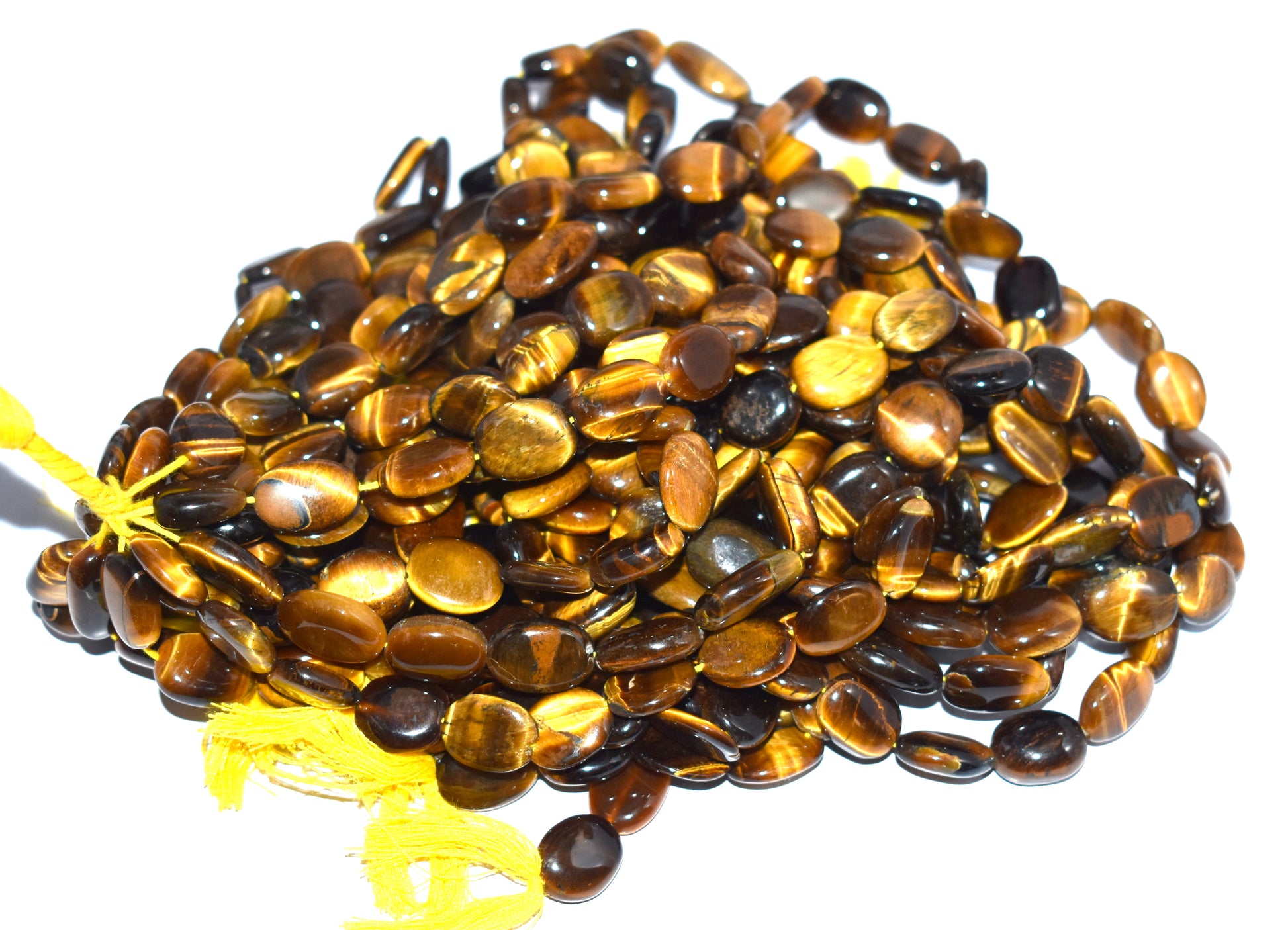 A 14-inch strand of natural Tiger Eye plain oval beads, perfect for creating striking, earthy jewelry designs.
#TigerEye #OvalBeads #GemstoneJewelry #JewelryMaking #NaturalGemstones #BeadedJewelry #CustomJewelry #EarthyDesigns #LuxuryJewelry #UniqueJewelry






