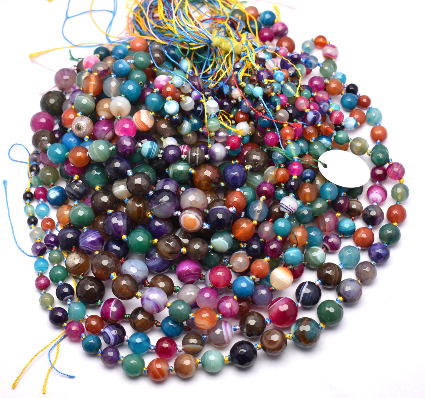 Add vibrant energy to your collection with this knotted multi-color agate bead strand (6mm to 16mm), offering a stunning array of hues.
 #AgateBeads #MultiColorJewelry #FacetedBeads #GemstoneBeads #CrystalJewelry #JewelryMaking #ColorfulBeads #HealingCrystals
