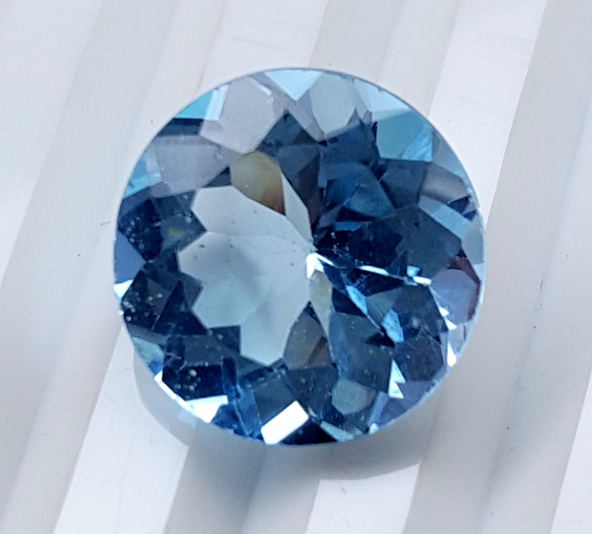 Blue Topaz round faceted gemstone, 13.50 carats, ideal for custom jewelry.
#BlueTopaz #LooseGemstone #FacetedGemstone #13.50Carat #TopazJewelry #NaturalTopaz #Gemstone