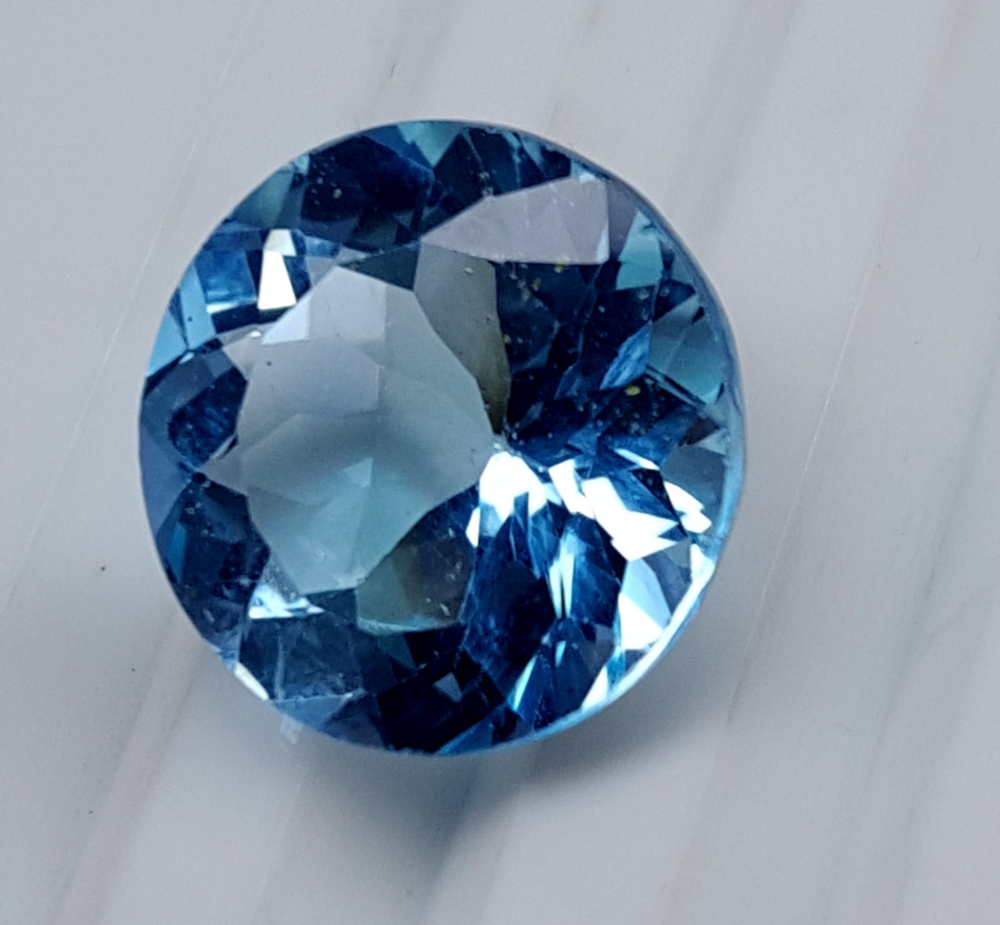 Blue Topaz round faceted gemstone, 13.50 carats, ideal for custom jewelry.
#BlueTopaz #LooseGemstone #FacetedGemstone #13.50Carat #TopazJewelry #NaturalTopaz #Gemstone