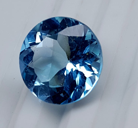 Blue Topaz round faceted gemstone, 13.50 carats, ideal for custom jewelry.
#BlueTopaz #LooseGemstone #FacetedGemstone #13.50Carat #TopazJewelry #NaturalTopaz #Gemstone