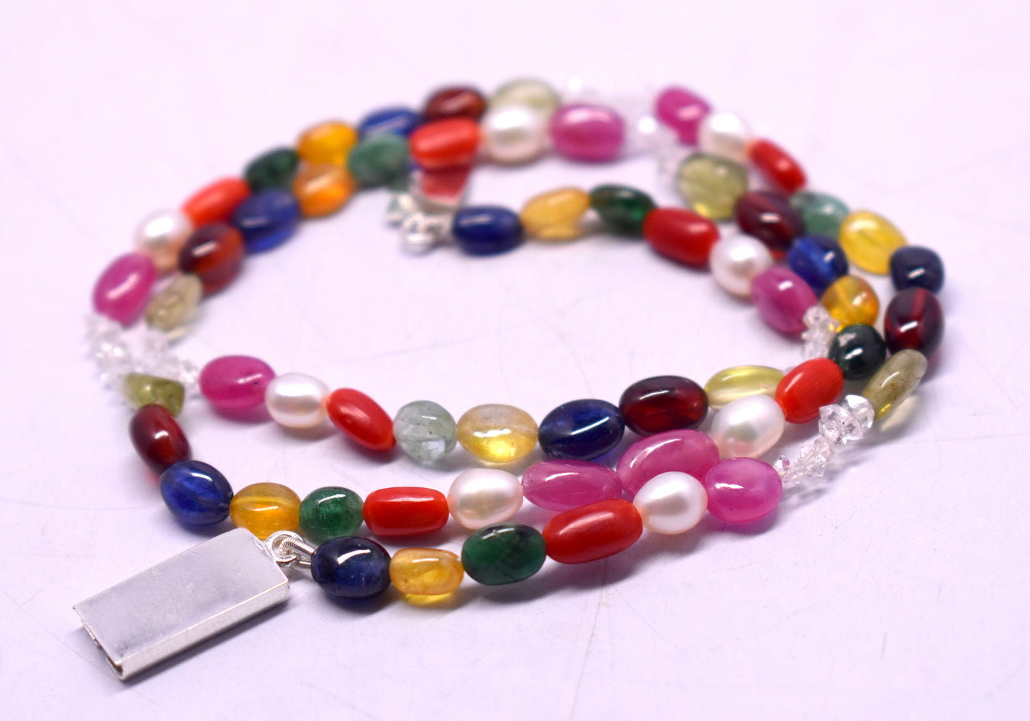 Navratan Mala with Lock for protection, positivity, and spiritual growth #NavratanMala #SpiritualGrowth #Protection #PositiveEnergy #MalaWithLock #HealingCrystals #EnergyHealing #NavratanJewelry #CrystalHealing #VastuDecor #HolisticHealing #SacredJewelry #DivineEnergy #SpiritualJewelry