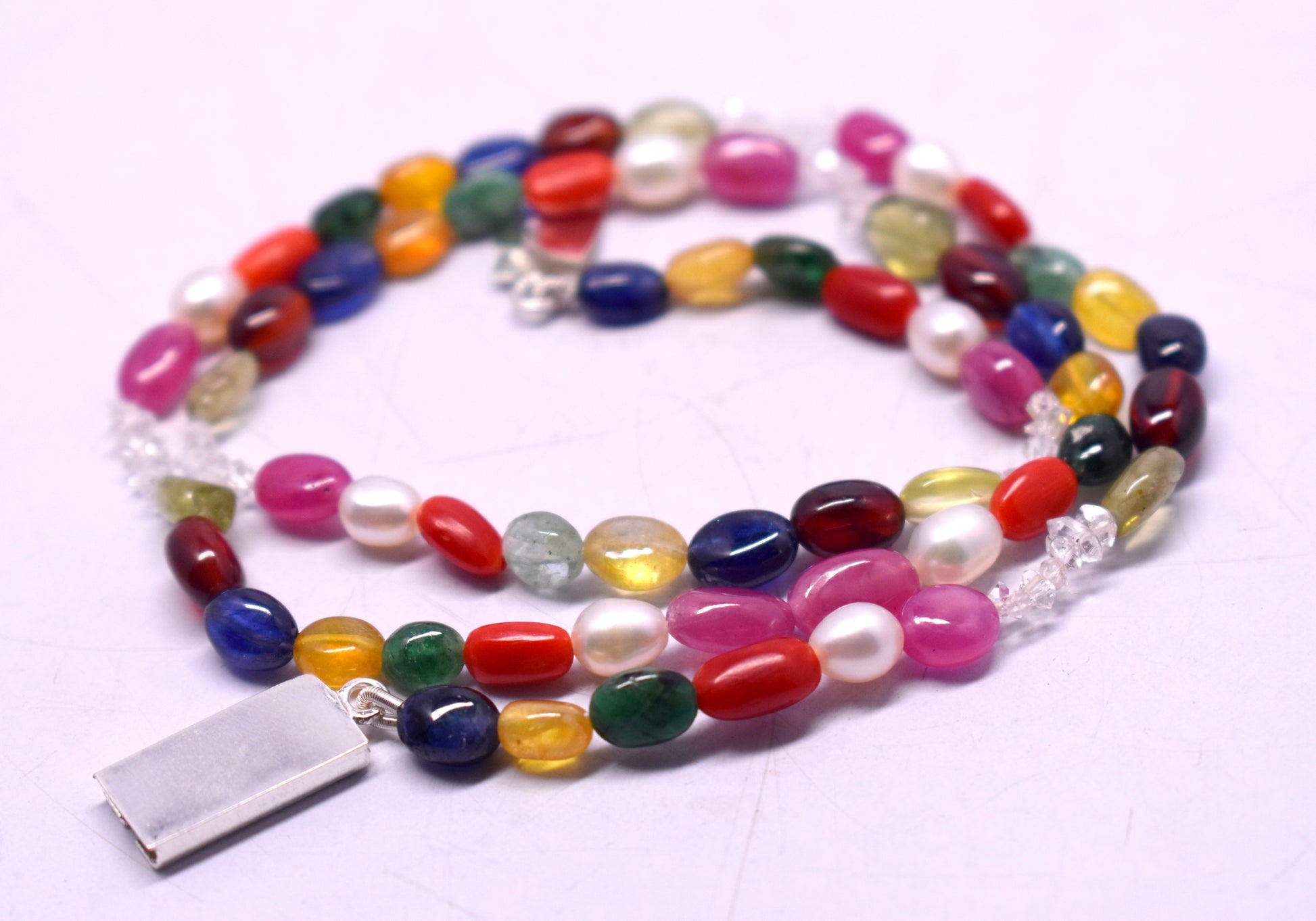 Navratan Mala with Lock for protection, positivity, and spiritual growth #NavratanMala #SpiritualGrowth #Protection #PositiveEnergy #MalaWithLock #HealingCrystals #EnergyHealing #NavratanJewelry #CrystalHealing #VastuDecor #HolisticHealing #SacredJewelry #DivineEnergy #SpiritualJewelry