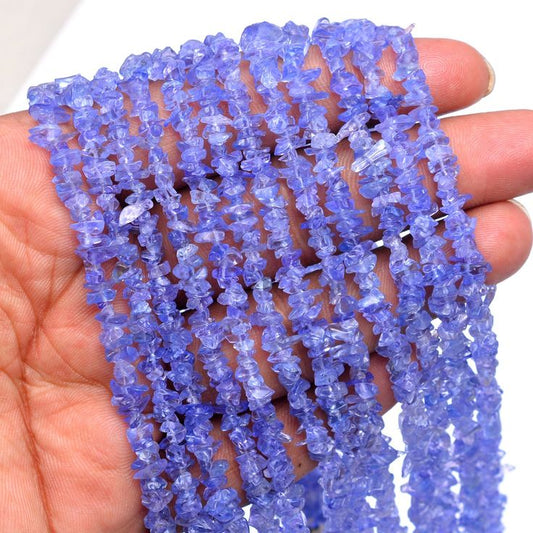 Tanzanite uncut mala, featuring natural, raw Tanzanite gemstones strung together in a traditional mala style, showcasing the unique deep blue-purple hues of each stone. #TanzaniteMala #UncutGemstones #RawTanzanite #HealingJewelry #SpiritualJewelry #TanzaniteBeads #NaturalGems #MalaBeads #GemstoneJewelry #UniqueJewelry #CrystalHealing #JewelryWithPurpose