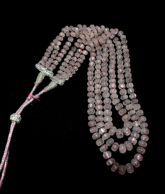 This Rose Quartz Necklace features melon faceted beads (6mm-9mm) with a tassel, offering elegance and charm.
 #RoseQuartzNecklace #FacetedBeads #TasselNecklace #GemstoneJewelry #HealingCrystals #ElegantJewelry






