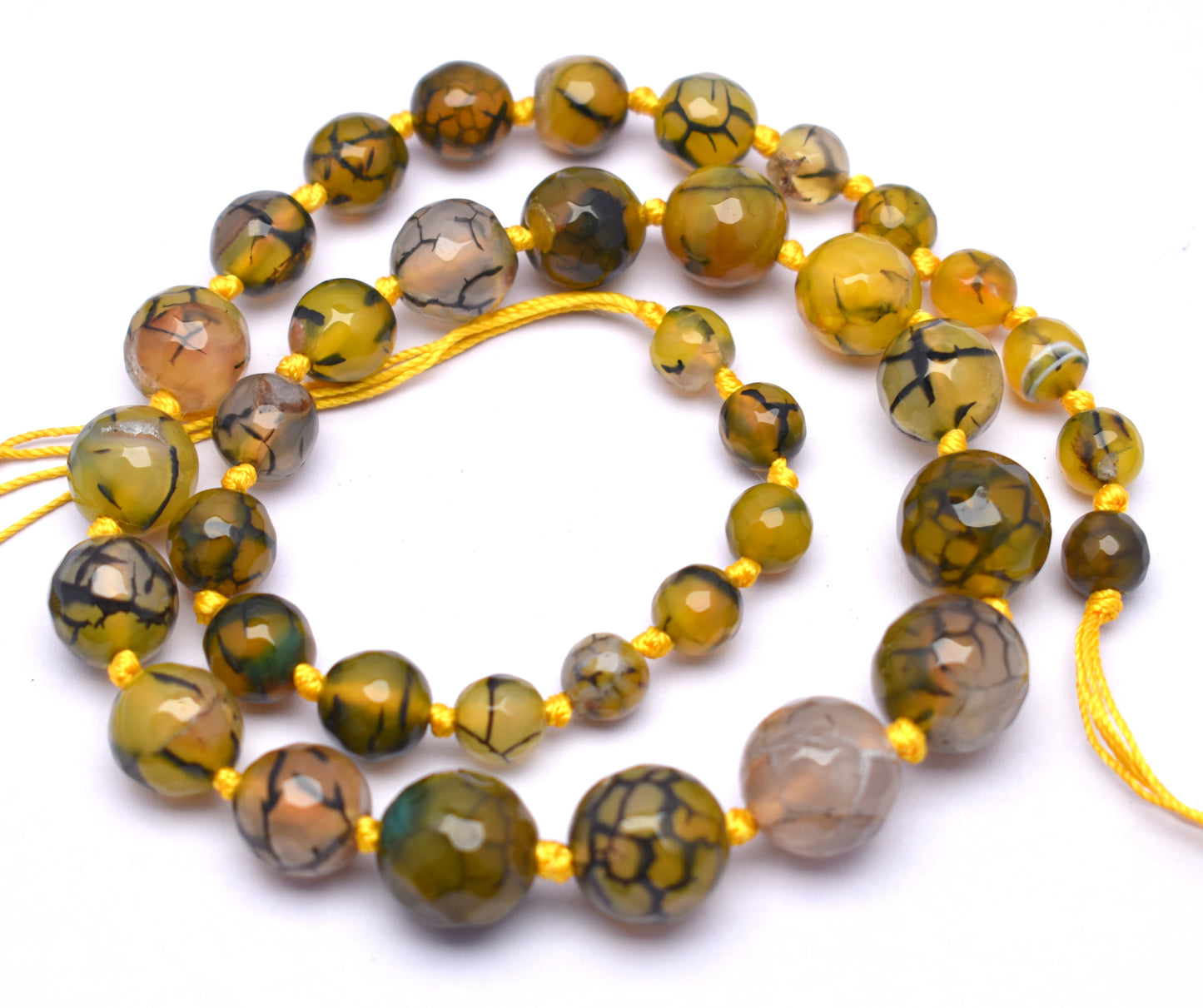 This beautiful strand features knotted, round faceted yellow agate beads (8mm to 14mm) for a vibrant and elegant look.
 #YellowAgate #AgateBeads #FacetedBeads #GemstoneJewelry #CrystalJewelry #HealingCrystals #FashionJewelry #JewelryMaking






