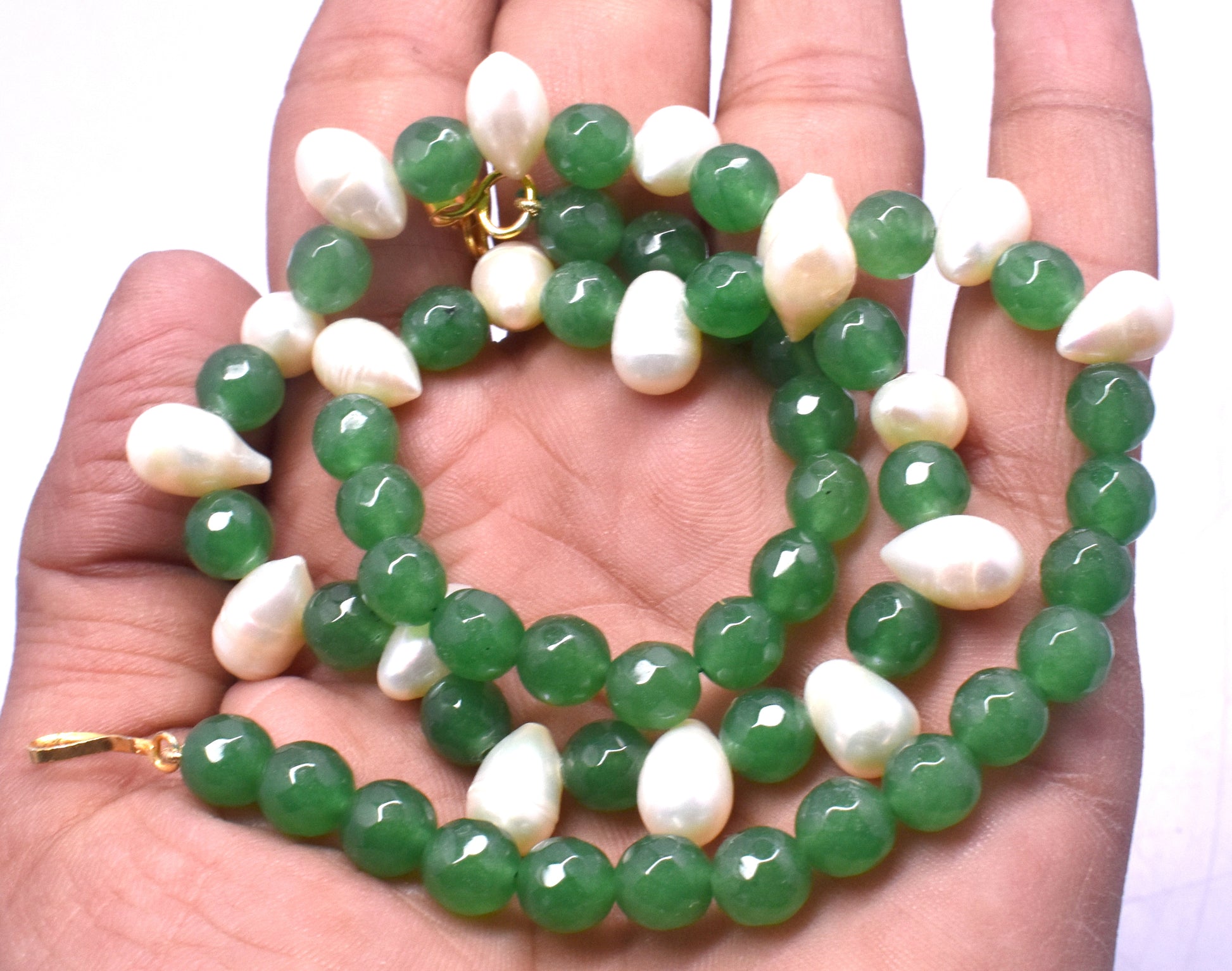 This elegant necklace features Green Aventurine and Pearl Mix beads (7.5mm to 8x13mm) with a secure lock closure.
 #GreenAventurineNecklace #PearlMixJewelry #GemstoneJewelry #ElegantNecklace #HealingCrystals #FashionJewelry
