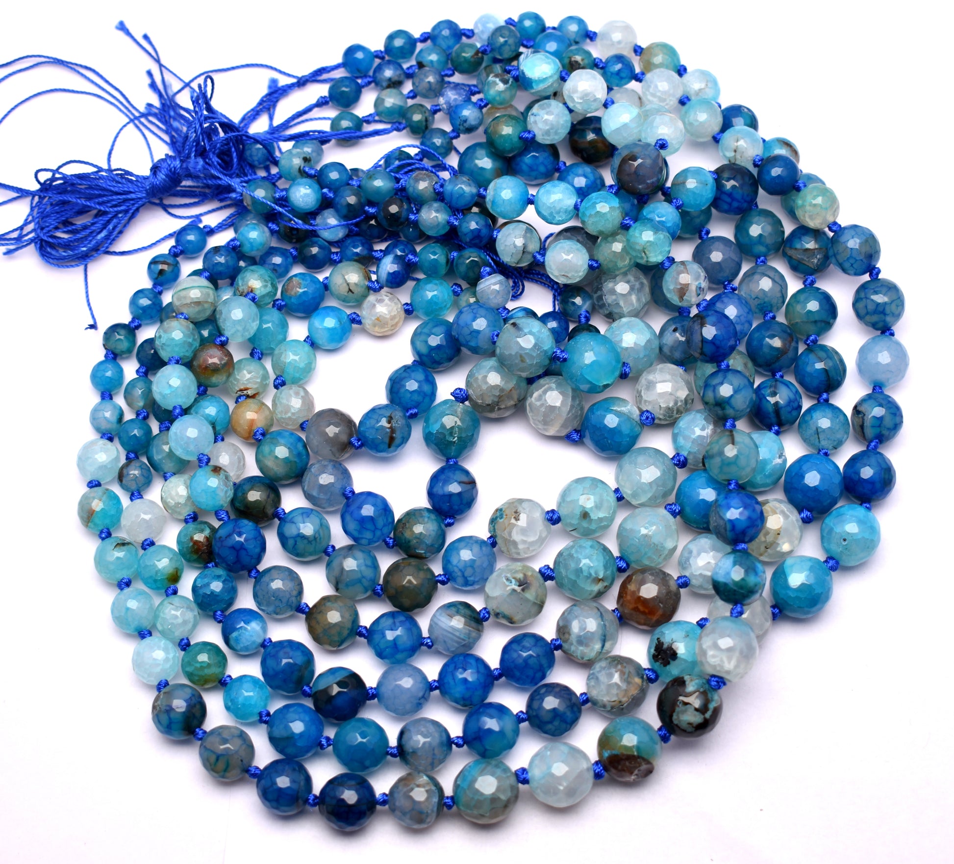 This exquisite strand of knotted, round faceted blue agate beads (8mm to 14mm) is perfect for adding serenity and style to your jewelry creations.
 #BlueAgateBeads #FacetedAgate #GemstoneStrand #HealingCrystals #CrystalJewelry #FashionJewelry #JewelryMaking #AgateJewelry

